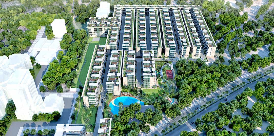 "An aerial view of Sector 79B in Gurgaon, showcasing modern residential and commercial developments, with well-planned road networks and lush green spaces, highlighting the dynamic and growing urban landscape of the area."